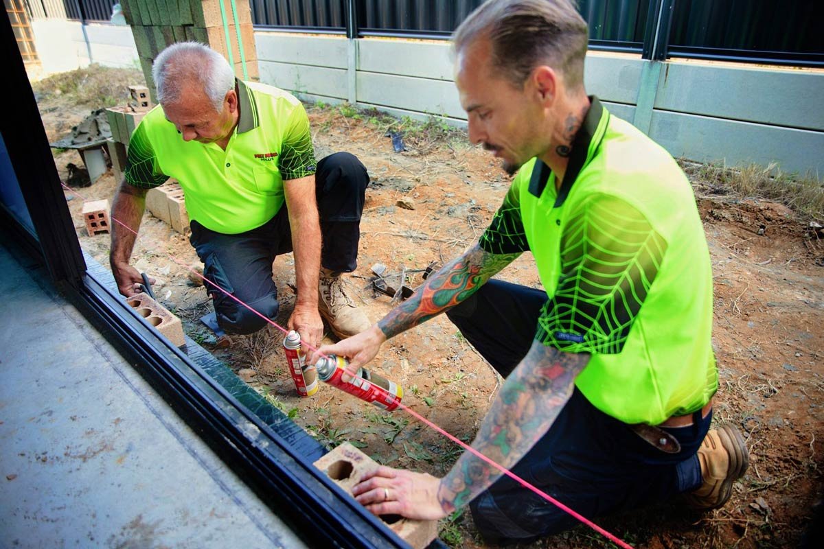Pest Proofing Solutions team, focused on their task | Featured image for the Brisbane pre construction termite treatment